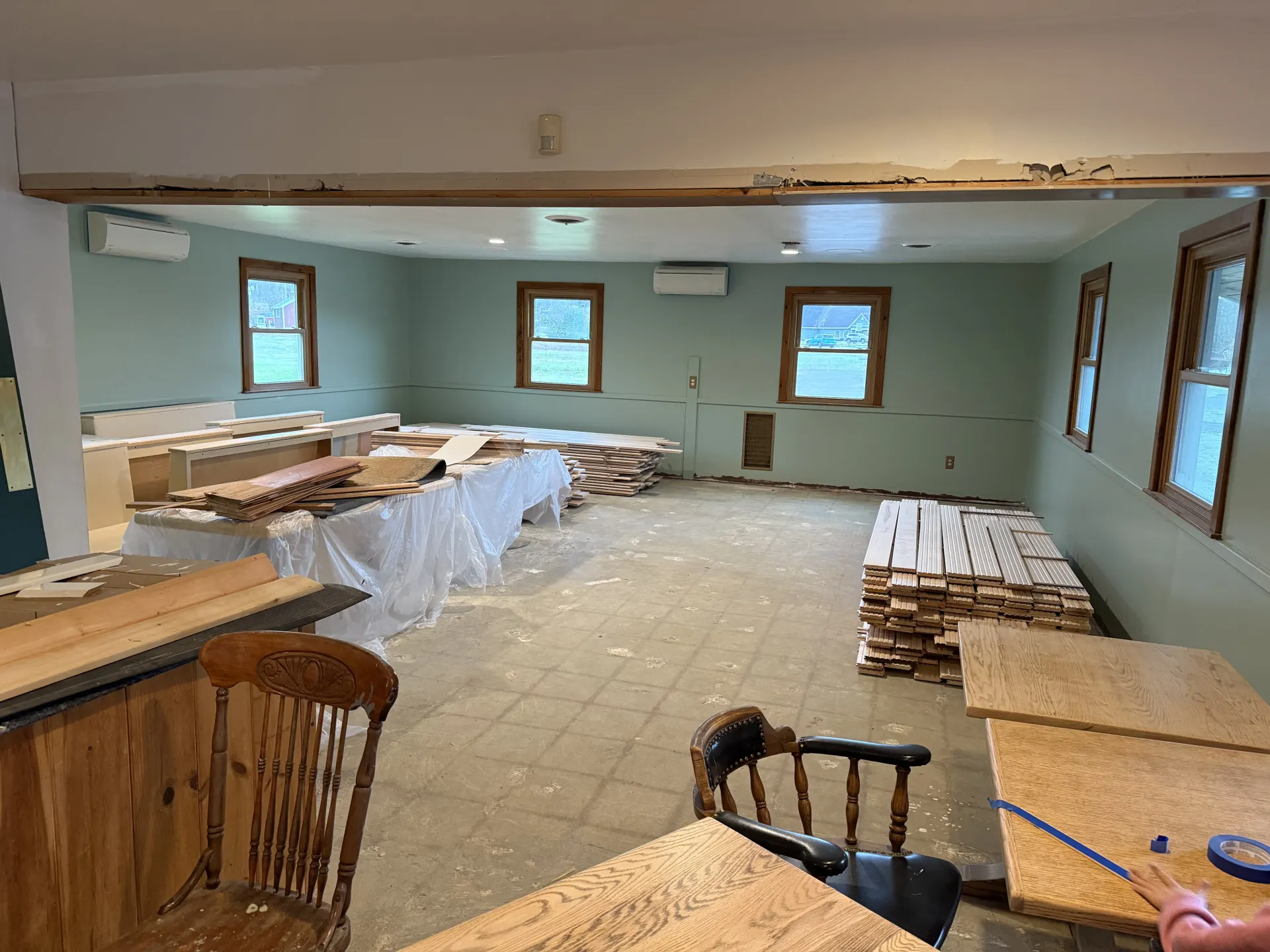 Interior of the Alder building during renovation, with exposed wood beams