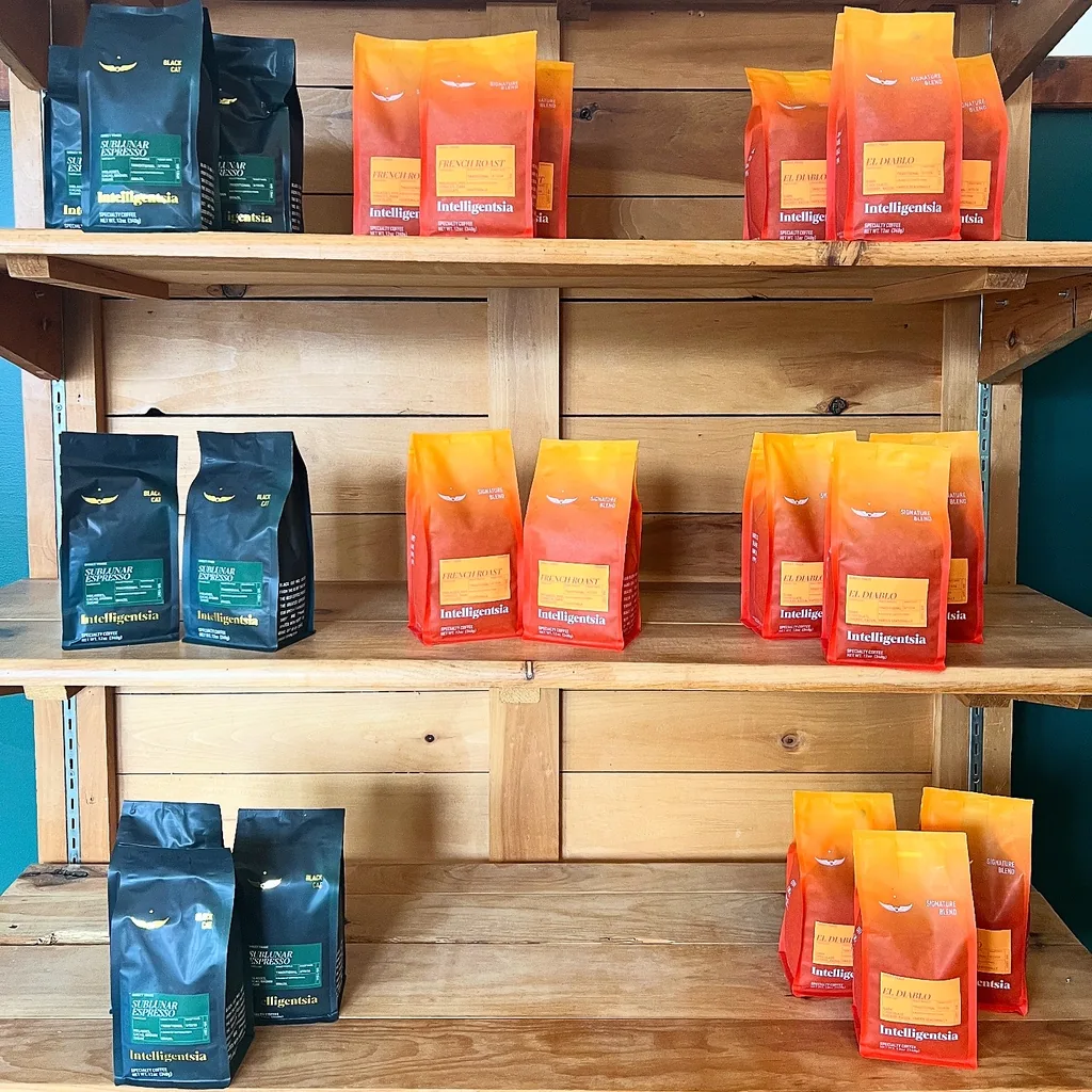 Shelves stocked with bags of Intelligentsia coffee