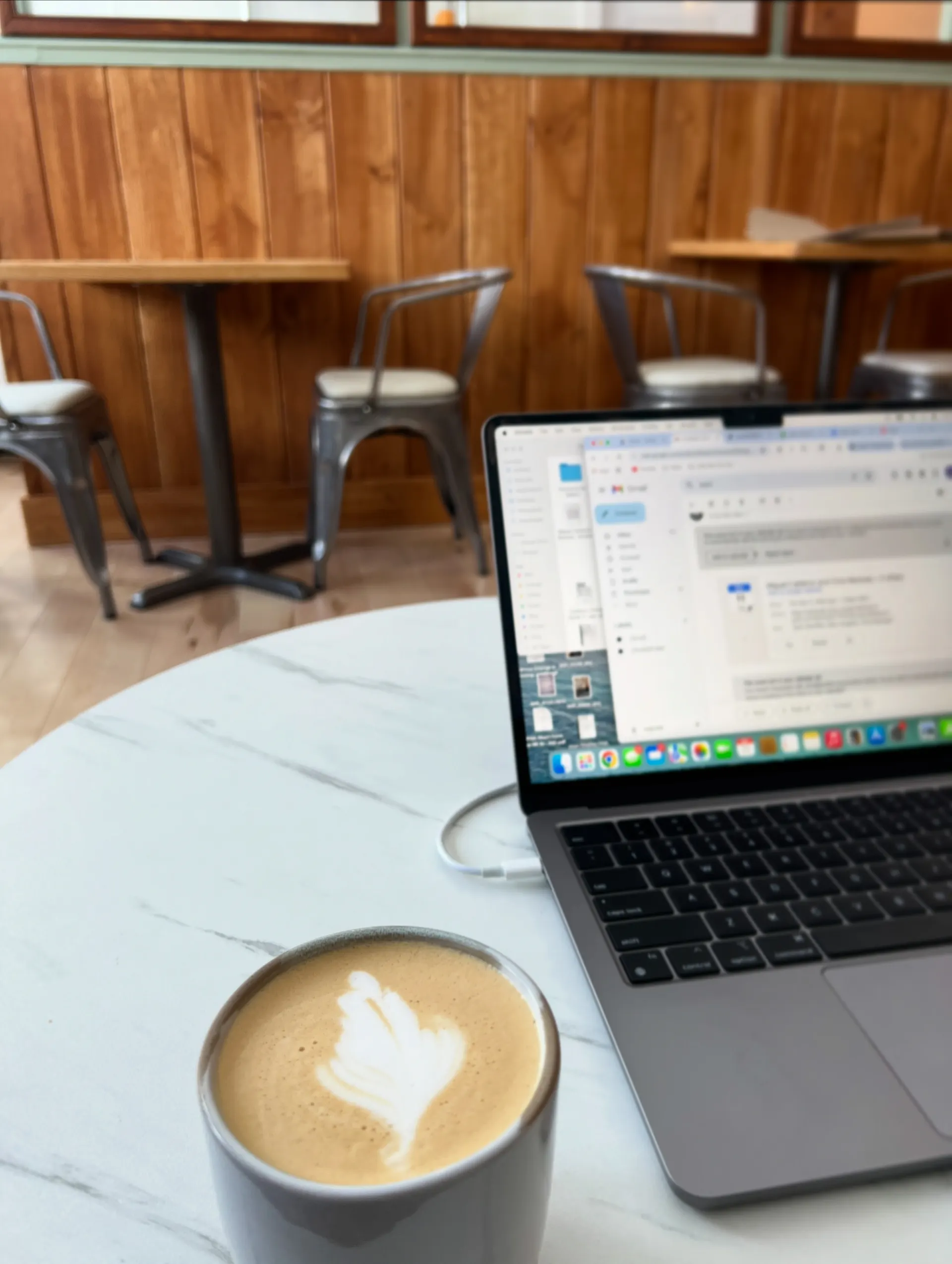 Latte and laptop on a table