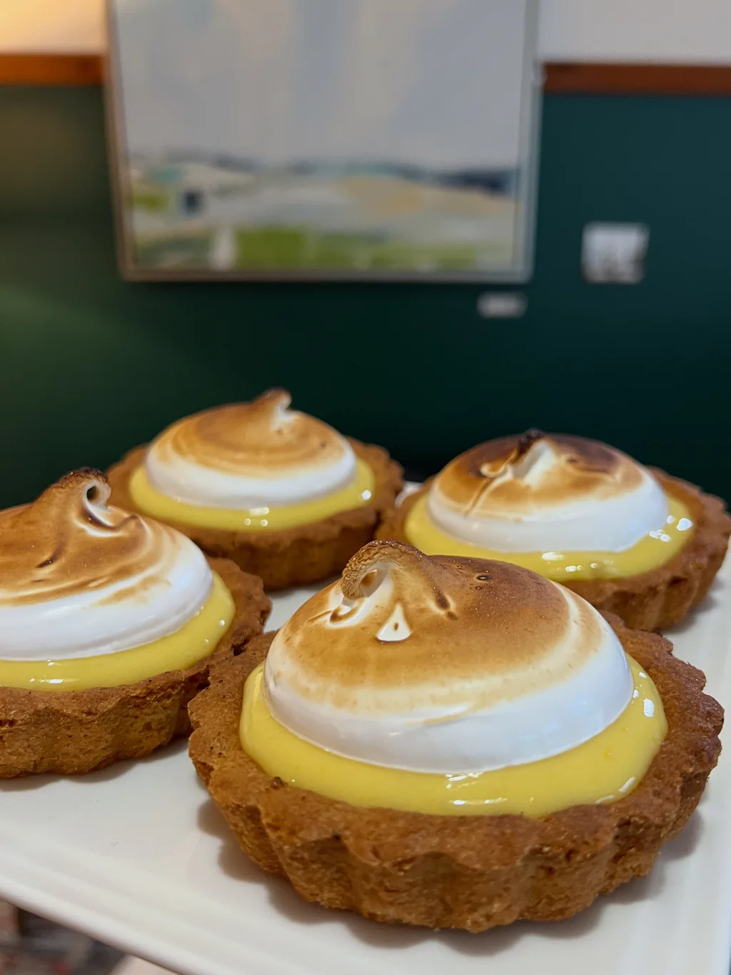 Lemon meringue almond mini tarts on the counter